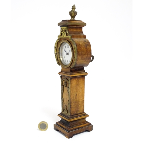 1400 - A Swiss miniature longcase clock with Arabic numerals Approx 11 1/2