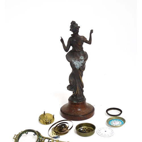 1409 - A Junghans Mystery ( swinging) clock  formed as a spelter lady approx 11 1/2