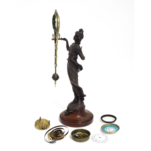 1409 - A Junghans Mystery ( swinging) clock  formed as a spelter lady approx 11 1/2