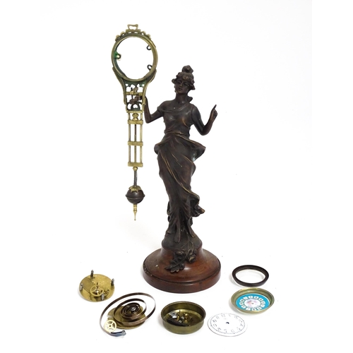 1409 - A Junghans Mystery ( swinging) clock  formed as a spelter lady approx 11 1/2