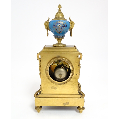 1412 - A 19thC French Japy Freres gilt metal and enamelled clock garniture, the blue penal decorated with g... 