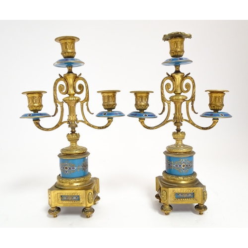 1412 - A 19thC French Japy Freres gilt metal and enamelled clock garniture, the blue penal decorated with g... 