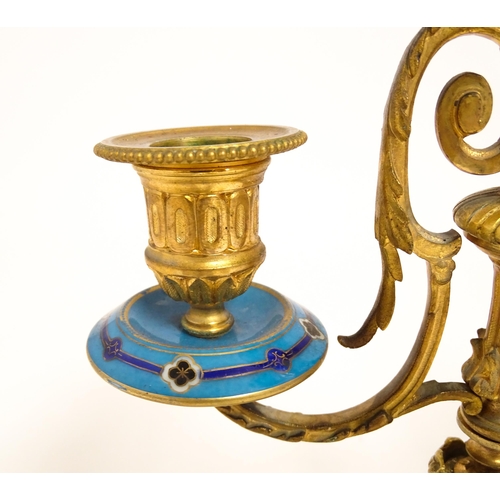 1412 - A 19thC French Japy Freres gilt metal and enamelled clock garniture, the blue penal decorated with g... 