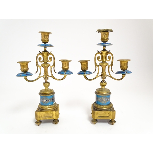 1412 - A 19thC French Japy Freres gilt metal and enamelled clock garniture, the blue penal decorated with g... 