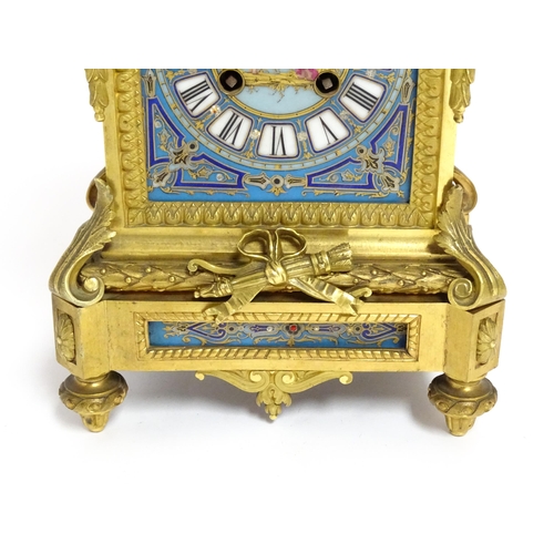 1412 - A 19thC French Japy Freres gilt metal and enamelled clock garniture, the blue penal decorated with g... 