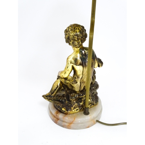 1419 - A 20thC table lamp decorated with a Bacchanalian figure mounted on an alabaster base. Approx. 21