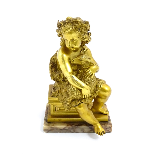 1011 - A 19thC cast and gilt sculpture modelled as Saint John the Baptist as a child holding a lamb, raised... 