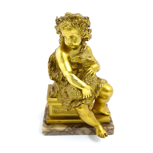 1011 - A 19thC cast and gilt sculpture modelled as Saint John the Baptist as a child holding a lamb, raised... 