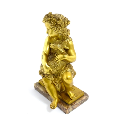 1011 - A 19thC cast and gilt sculpture modelled as Saint John the Baptist as a child holding a lamb, raised... 