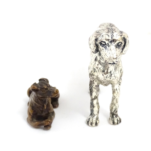 1017 - A small late 19th / early 20thC bronze model of a dog / hound. Together with a silver plate model of... 