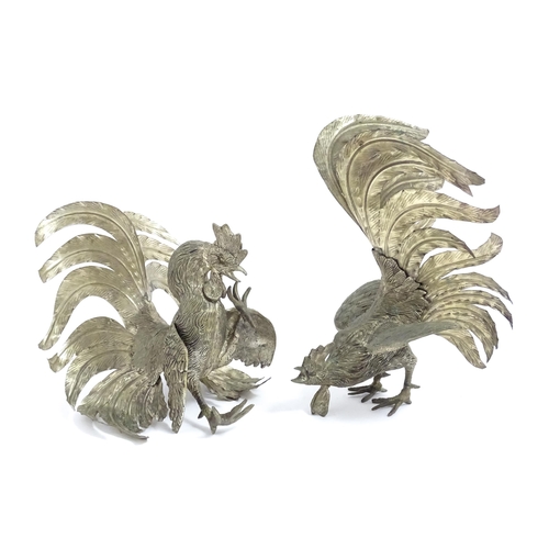 1021 - A pair of 20thC cast models of fighting cocks. Largest approx. 12 1/4