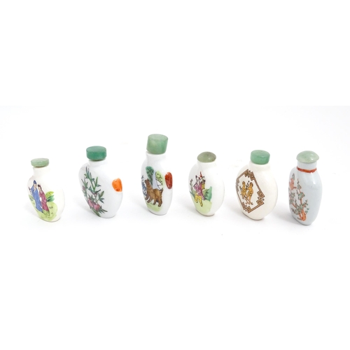 1030 - Six Chinese ceramic snuff bottles to include examples with hand painted decoration to include birds,... 