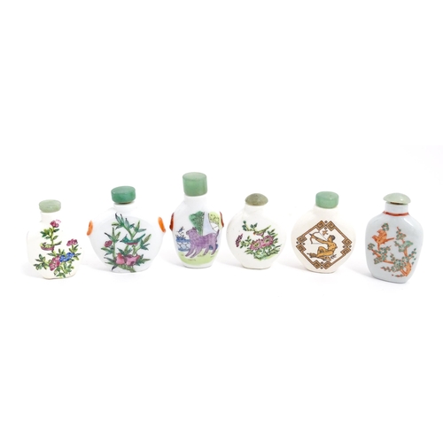 1030 - Six Chinese ceramic snuff bottles to include examples with hand painted decoration to include birds,... 