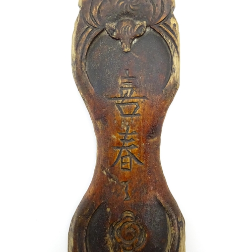 1033 - A quantity of Chinese silk winders to include a lacquered example with stylised bat and cloud detail... 