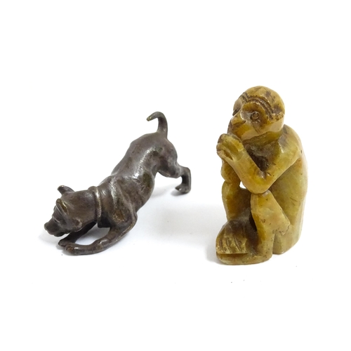 1038 - A Chinese carved soapstone model of a monkey. Together with an early 20thC bronze model of a dog / h... 