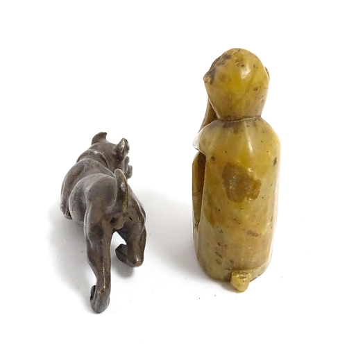 1038 - A Chinese carved soapstone model of a monkey. Together with an early 20thC bronze model of a dog / h... 