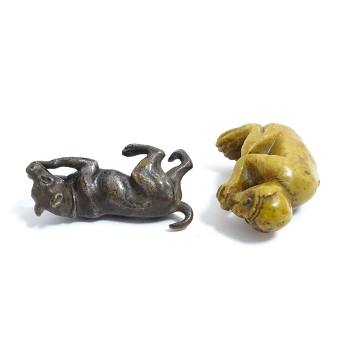 1038 - A Chinese carved soapstone model of a monkey. Together with an early 20thC bronze model of a dog / h... 