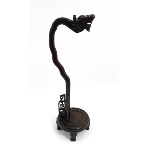 1047 - A Chinese carved hardwood lantern / lamp stand with dragon head and fretwork detail. Approx. 27 3/4