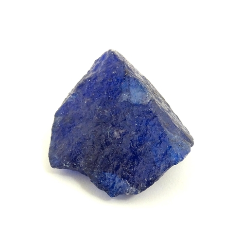 1067 - Natural History / Geology Interest: A raw / rough uncut natural sapphire. With identification report... 