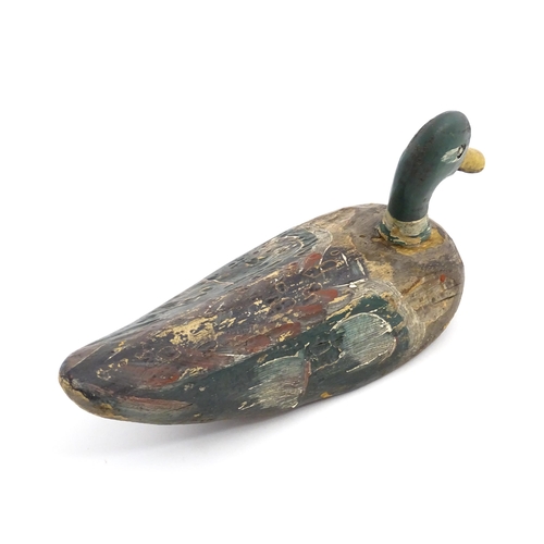 1077 - An early 20thC hand carved and painted wooden duck decoy in the form of a drake Mallard , approx 14