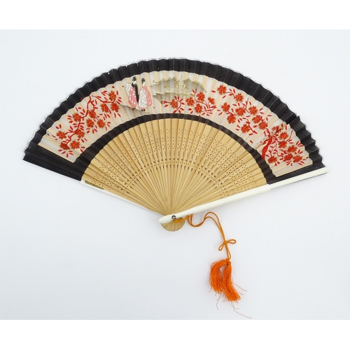 1079 - Three assorted 20thC wooden fans to include a 32 stick example with pierced decoration and hand pain... 