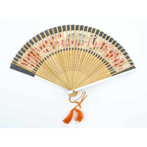 1079 - Three assorted 20thC wooden fans to include a 32 stick example with pierced decoration and hand pain... 