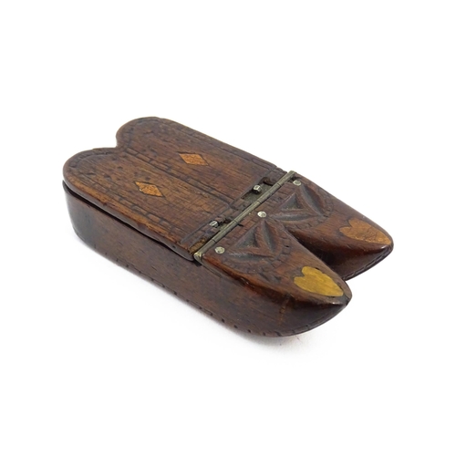 1138 - Treen : A 19thC double shoe snuff box modelled as a pair of shoes with hinged top, carved decoration... 