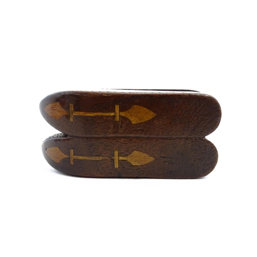 1138 - Treen : A 19thC double shoe snuff box modelled as a pair of shoes with hinged top, carved decoration... 