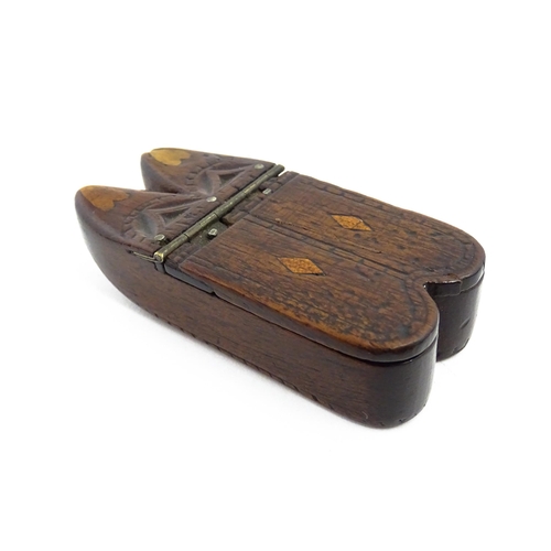 1138 - Treen : A 19thC double shoe snuff box modelled as a pair of shoes with hinged top, carved decoration... 