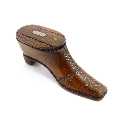 1141 - Treen : A 19thC shoe snuff box with sliding lid and inlaid brass studwork decoration. Approx. 3 3/4