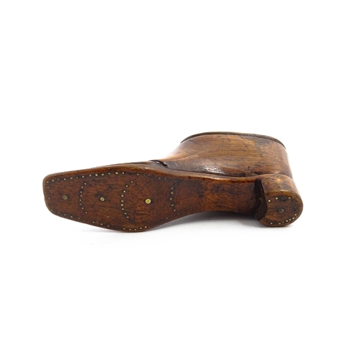 1141 - Treen : A 19thC shoe snuff box with sliding lid and inlaid brass studwork decoration. Approx. 3 3/4