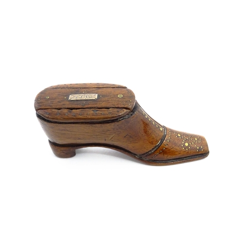 1141 - Treen : A 19thC shoe snuff box with sliding lid and inlaid brass studwork decoration. Approx. 3 3/4