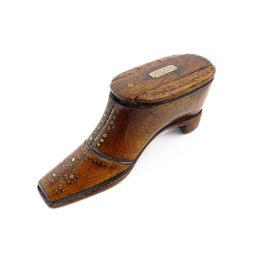 1141 - Treen : A 19thC shoe snuff box with sliding lid and inlaid brass studwork decoration. Approx. 3 3/4