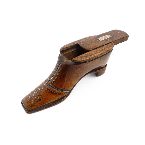 1141 - Treen : A 19thC shoe snuff box with sliding lid and inlaid brass studwork decoration. Approx. 3 3/4