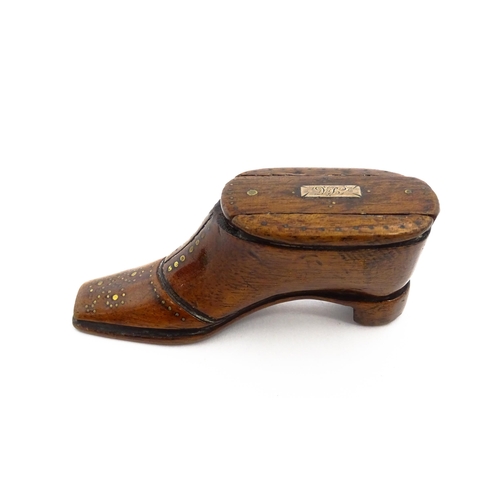 1141 - Treen : A 19thC shoe snuff box with sliding lid and inlaid brass studwork decoration. Approx. 3 3/4