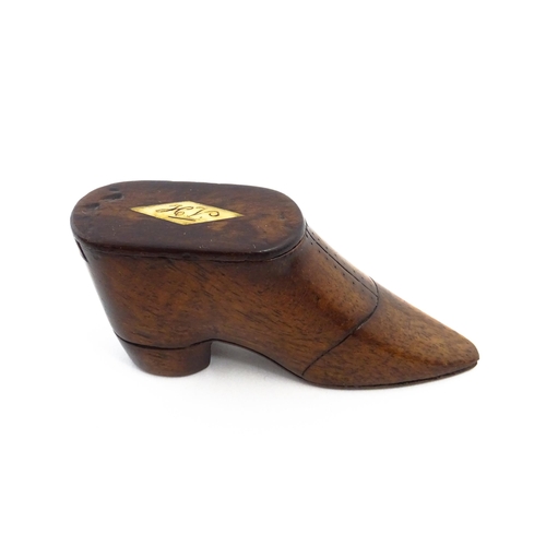 1142 - Treen : A 19thC shoe snuff box with sliding lid, incised detail and inlaid lozenge to top. Approx. 3... 