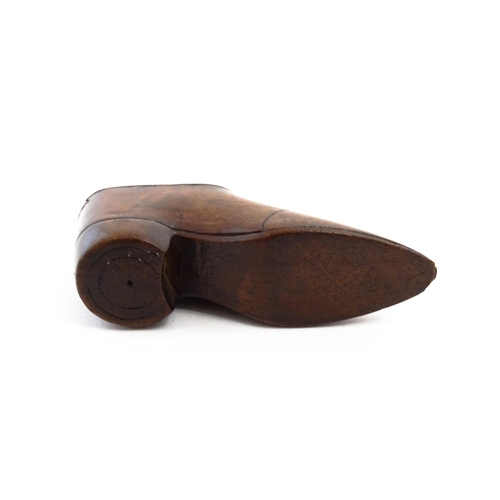 1142 - Treen : A 19thC shoe snuff box with sliding lid, incised detail and inlaid lozenge to top. Approx. 3... 