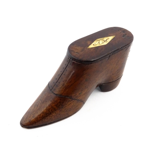 1142 - Treen : A 19thC shoe snuff box with sliding lid, incised detail and inlaid lozenge to top. Approx. 3... 