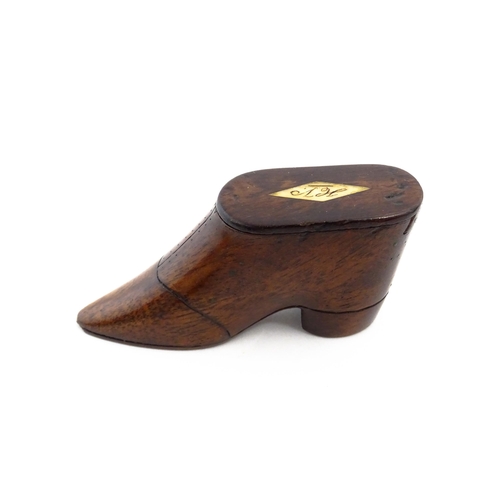 1142 - Treen : A 19thC shoe snuff box with sliding lid, incised detail and inlaid lozenge to top. Approx. 3... 