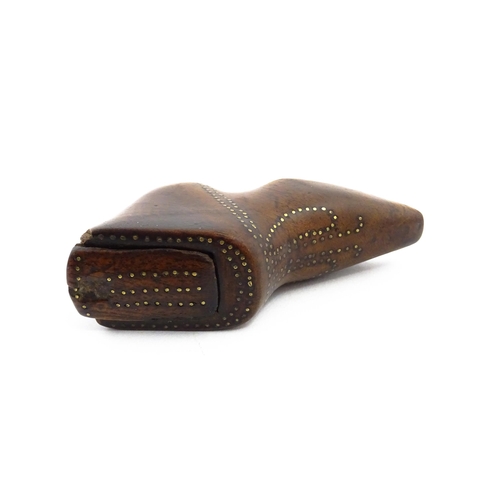 1144 - Treen : A 19thC shoe snuff box of boot form with sliding lid and inlaid brass studwork decoration. A... 