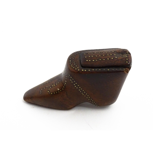 1144 - Treen : A 19thC shoe snuff box of boot form with sliding lid and inlaid brass studwork decoration. A... 