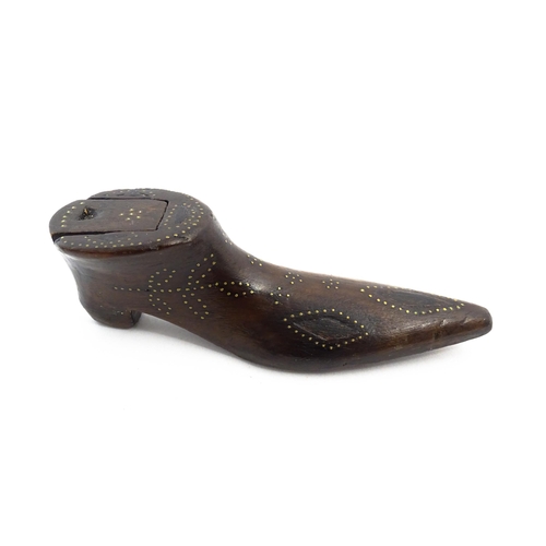 1148 - Treen : A 19thC shoe snuff box with sliding lid and inlaid brass studwork decoration. Approx. 4 3/4