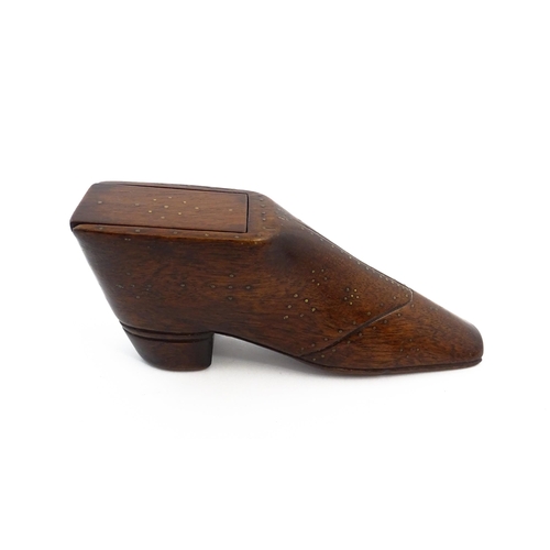 1150 - Treen : A large 19thC shoe snuff box / table snuff with sliding lid and inlaid brass studwork decora... 