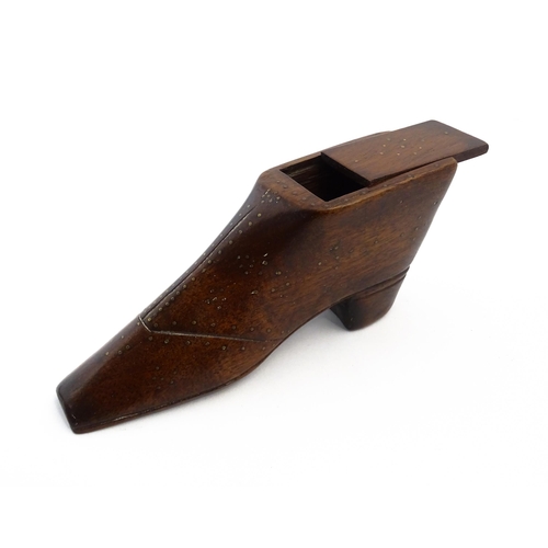 1150 - Treen : A large 19thC shoe snuff box / table snuff with sliding lid and inlaid brass studwork decora... 