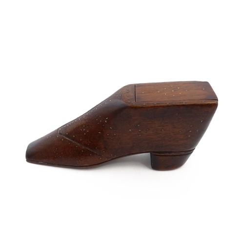 1150 - Treen : A large 19thC shoe snuff box / table snuff with sliding lid and inlaid brass studwork decora... 