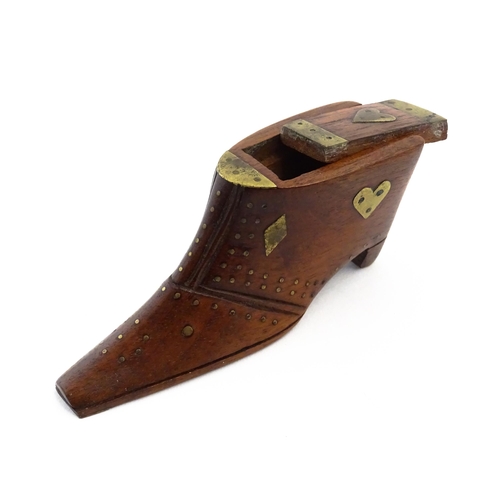 1152 - Treen : A 19thC shoe snuff box, the sliding lid with brass mounts, decorated with heart and diamond ... 