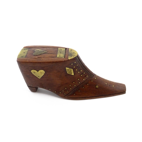 1152 - Treen : A 19thC shoe snuff box, the sliding lid with brass mounts, decorated with heart and diamond ... 