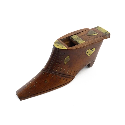 1152 - Treen : A 19thC shoe snuff box, the sliding lid with brass mounts, decorated with heart and diamond ... 