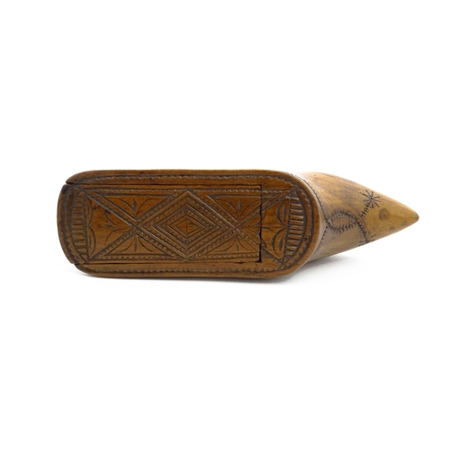 1153 - Treen : A 19thC Continental shoe table snuff box with chip carved decoration to the sliding top. App... 