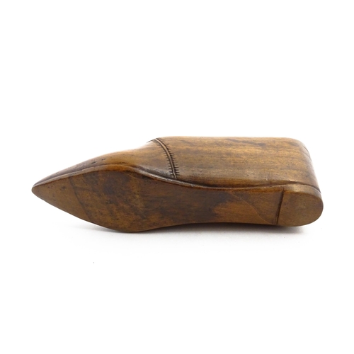 1153 - Treen : A 19thC Continental shoe table snuff box with chip carved decoration to the sliding top. App... 